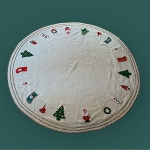 Vintage 70” cream tablecloth, tree skirt/base with stocking Santa wreath angel